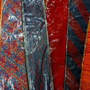 Four silk ties. All red and blue colors in different patterns